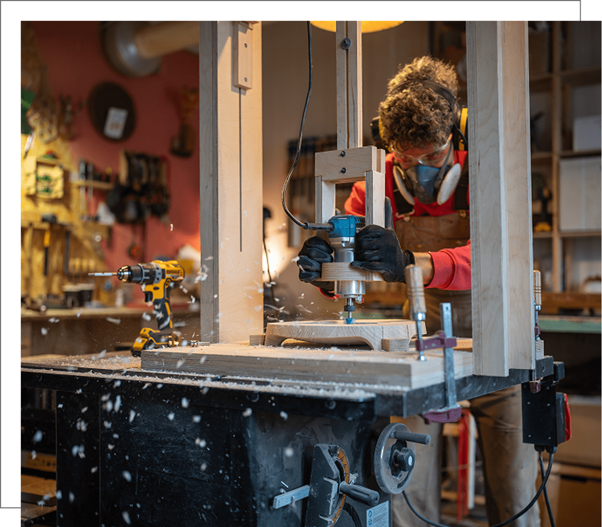 Woodworker using power tools in workshop