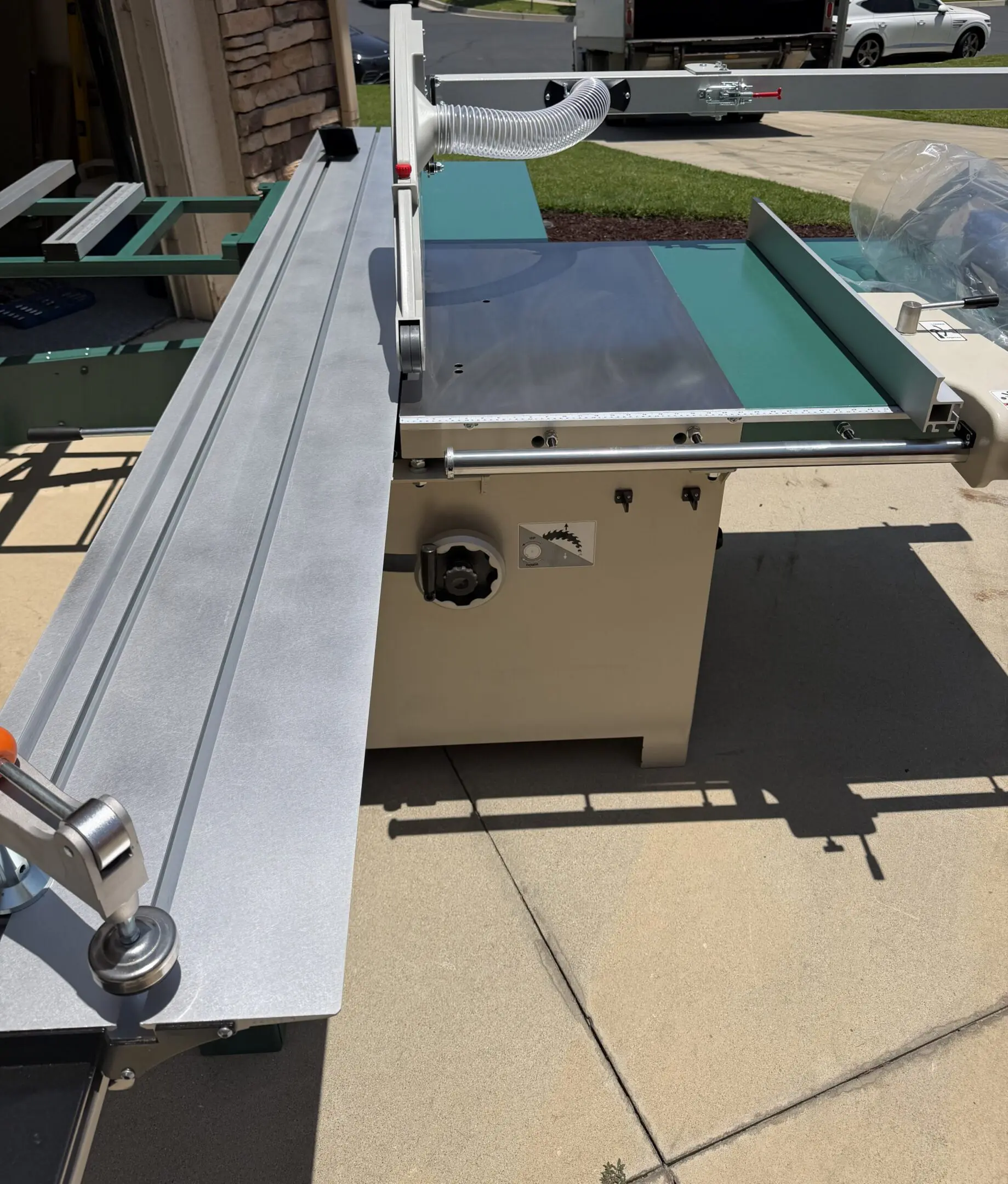 table saw with sliding fence outdoors