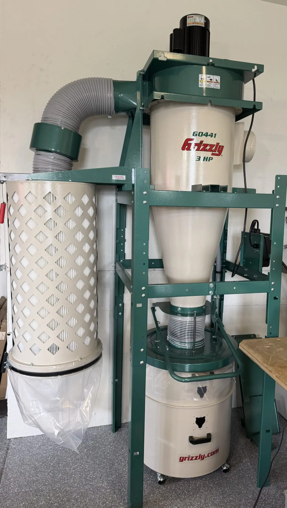 Green Grizzly cyclone dust collector in workshop