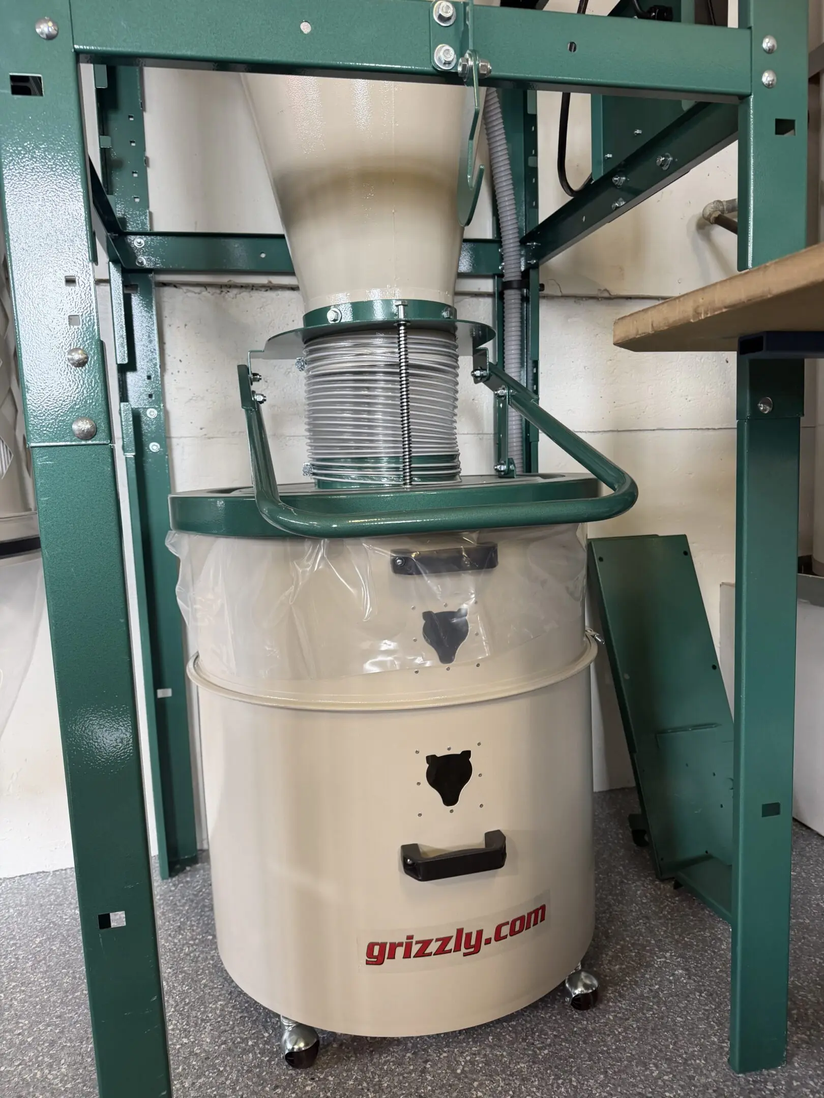 Grizzly dust collector under woodworking table